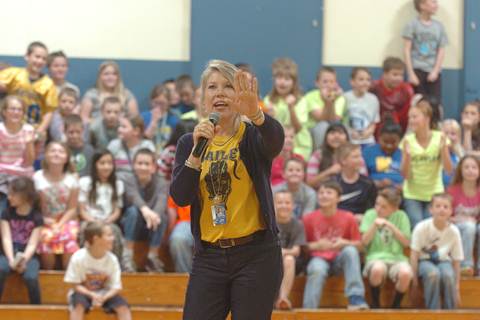 Bailey Principal Angela Compton reacts to the challenge of kissing a pig or a snake set forth by Counselor Keitha Chalupa should the students meet their passing percent goal.