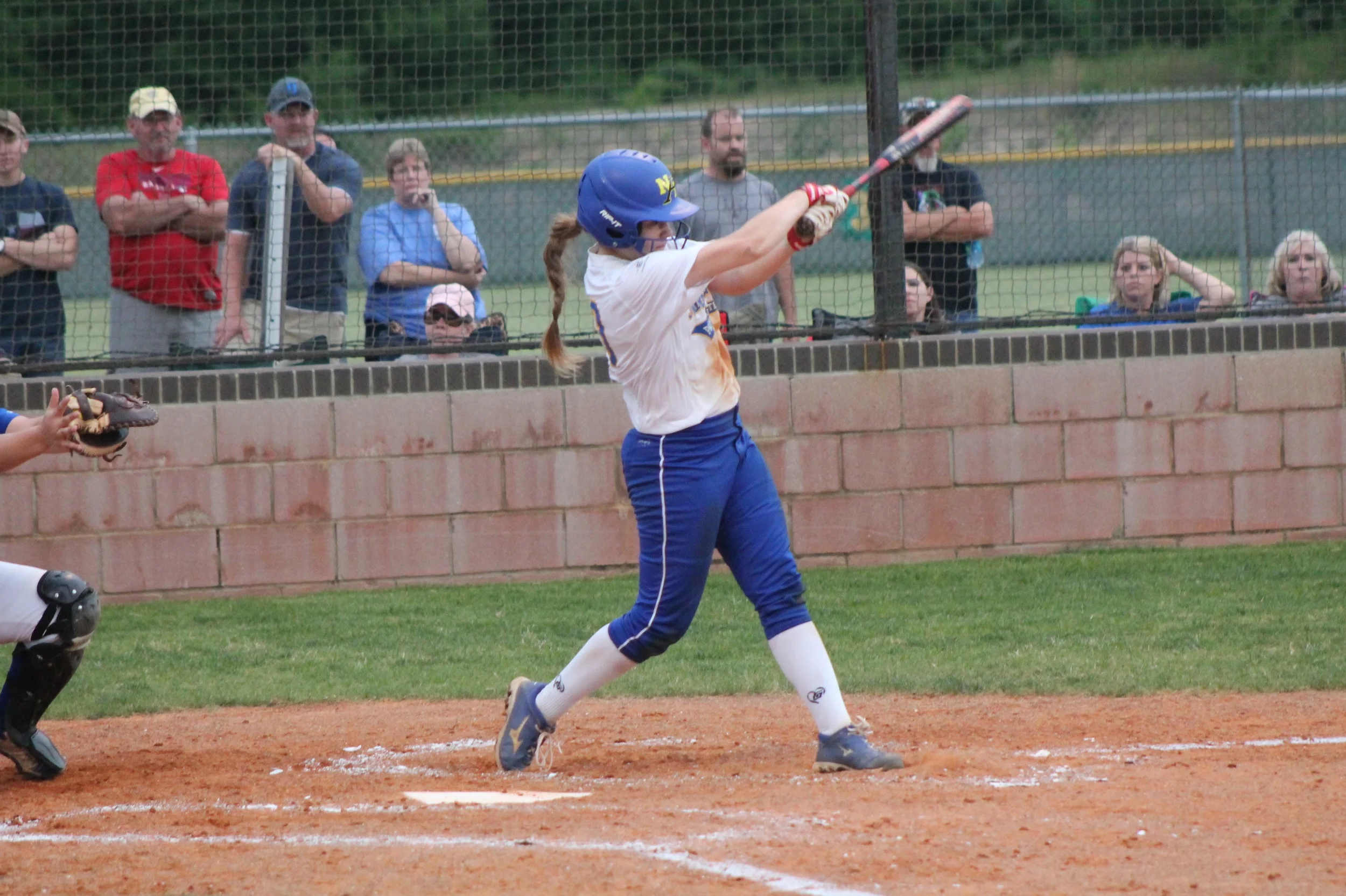 Bailee Nickerson with one of her two hits in Game 1 against Brownsboro.