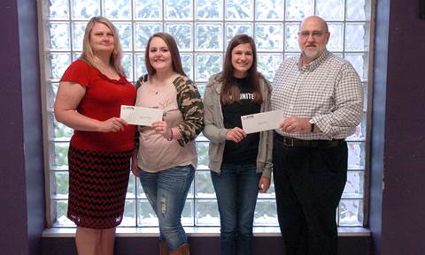 Presenting scholarships to Cheyenne Whitney, middle left, and Riley Preston, middle right, on behalf of the North Lamar Association of Texas Professional Educators (ATPE) are Vice President Annette Lewis, and President Jerry Jarrell.