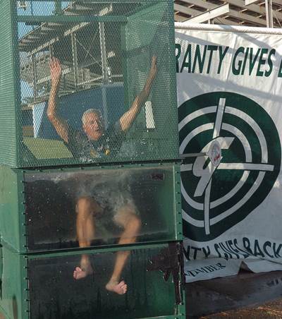 North Lamar Athletic Director Tim Billings takes a plunge in the dunking booth at the 2014 Fall Sports Kickoff Party.