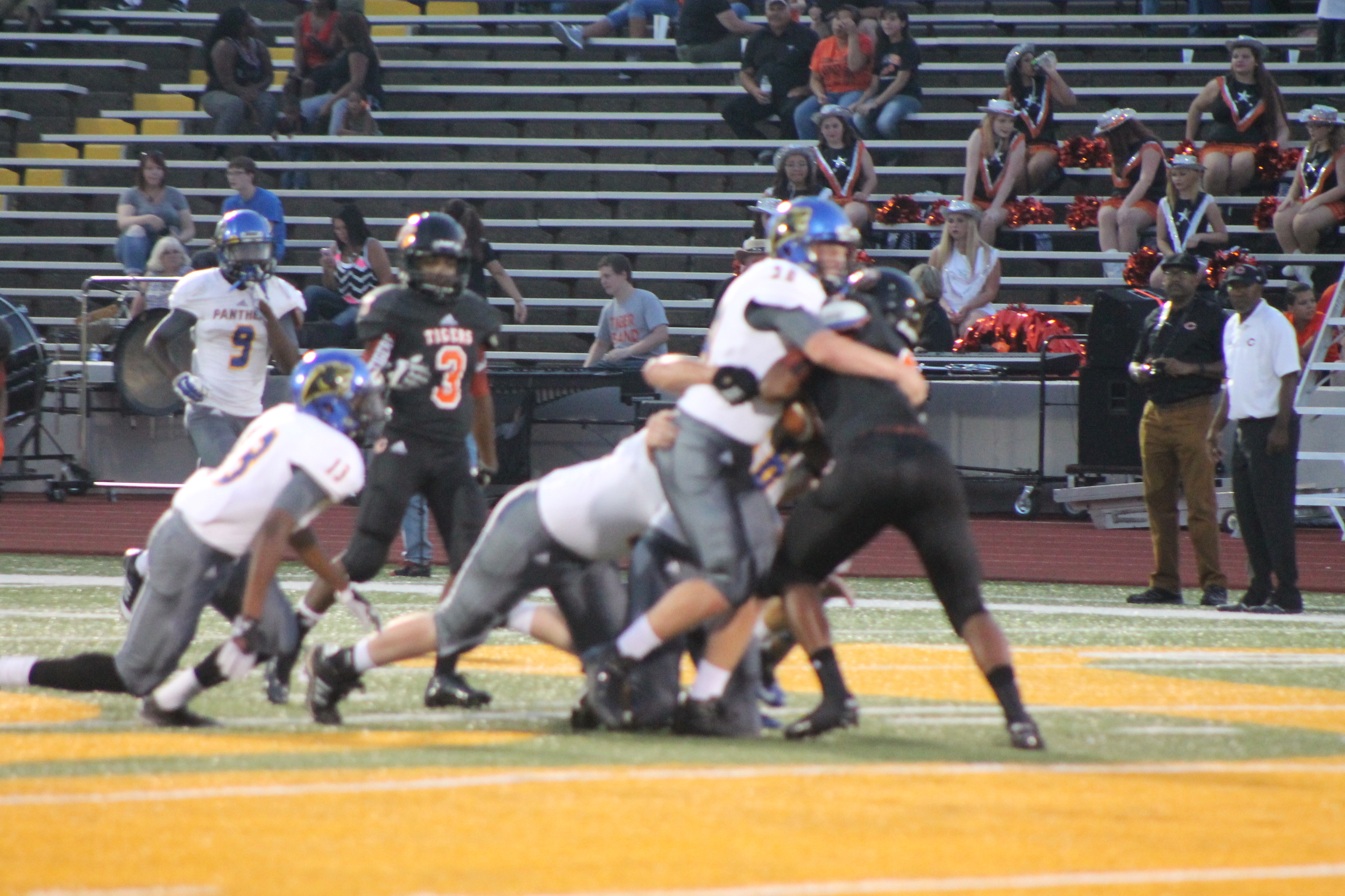 (Photo by Maddy Routon) North Lamar defenders taking down a Commerce player