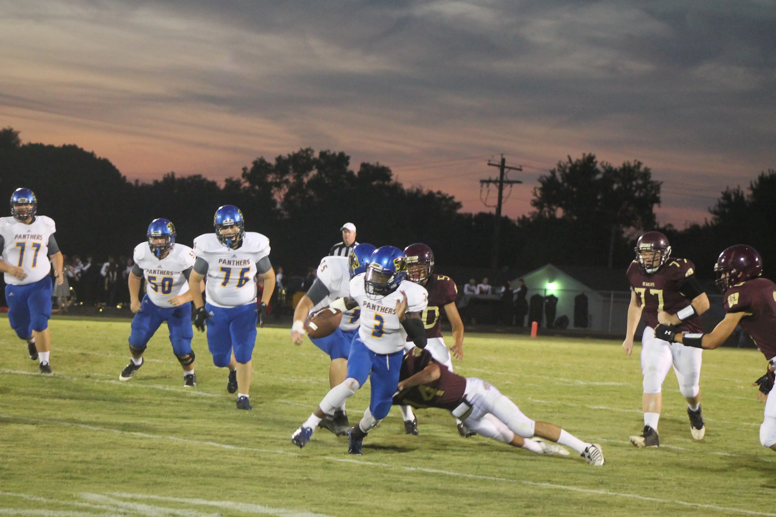(Photo by Adam Routon) Versache Buchanan (3) escaping a tackle on his way to the end zone for North Lamar.