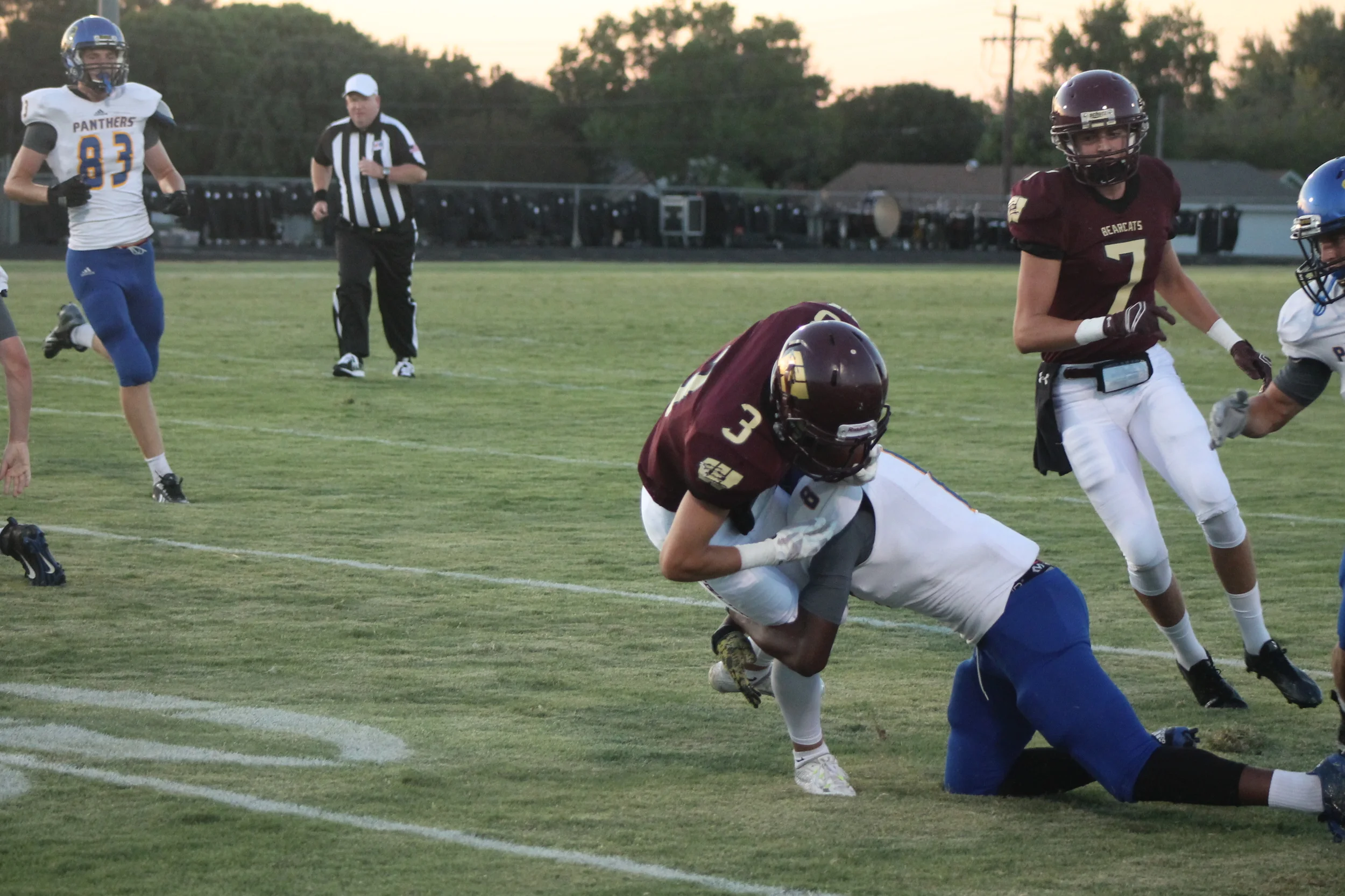 (Photo by Adam Routon) Tyler Hill with an open-field tackle for North Lamar as Jack Hill (82) looks on.
