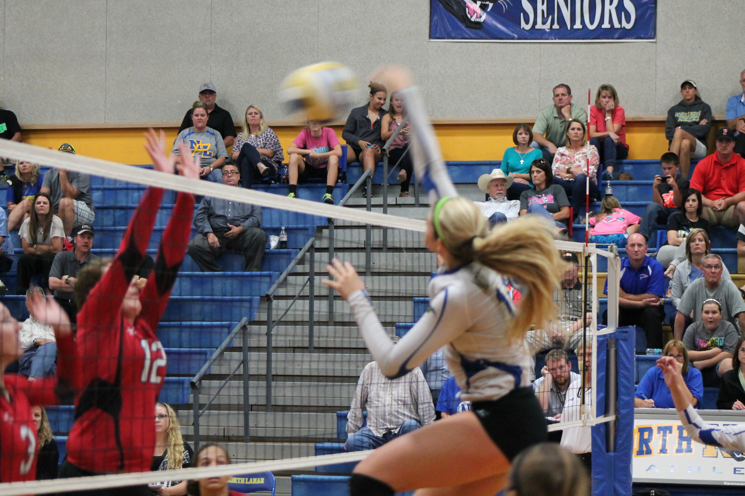 Bailey Foy with a spike against Melissa.