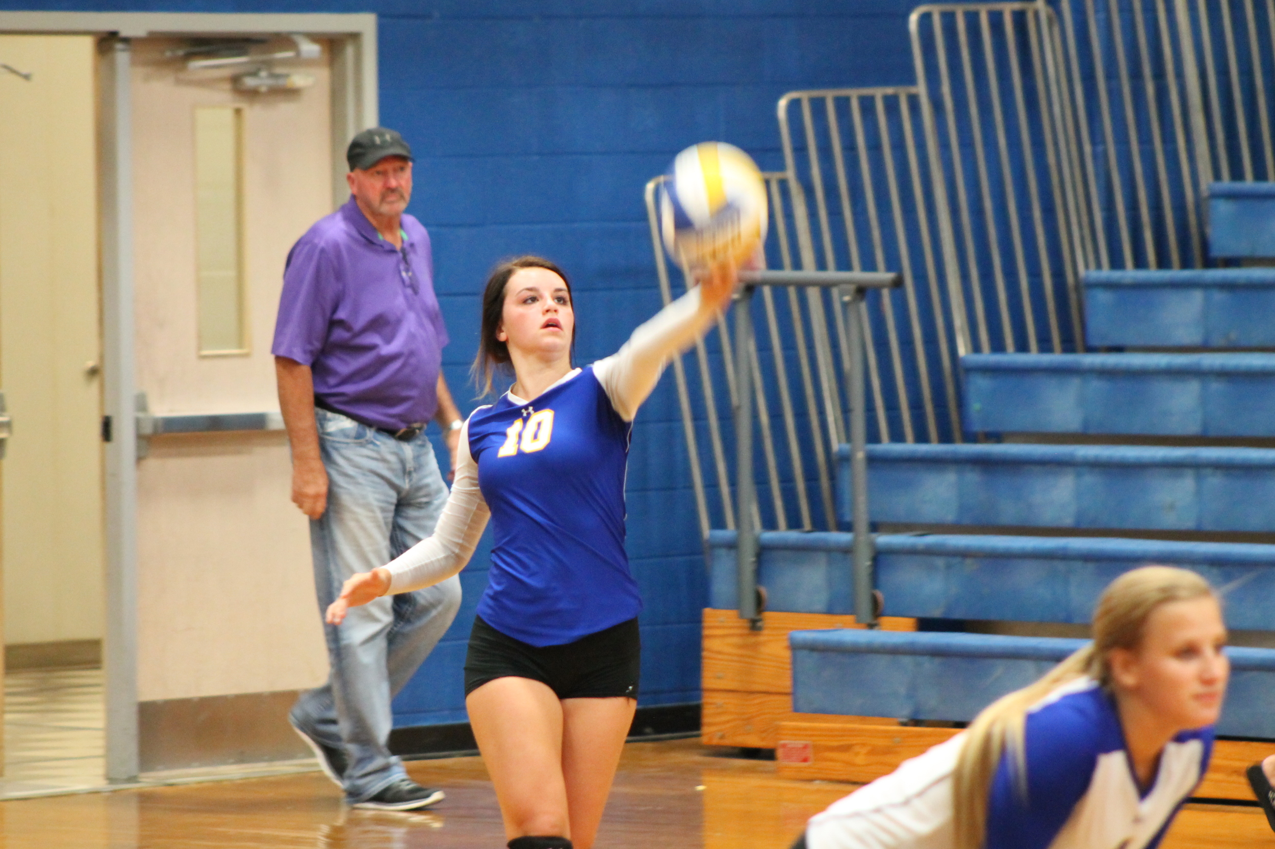 Mara Mabry serving the ball against Melissa