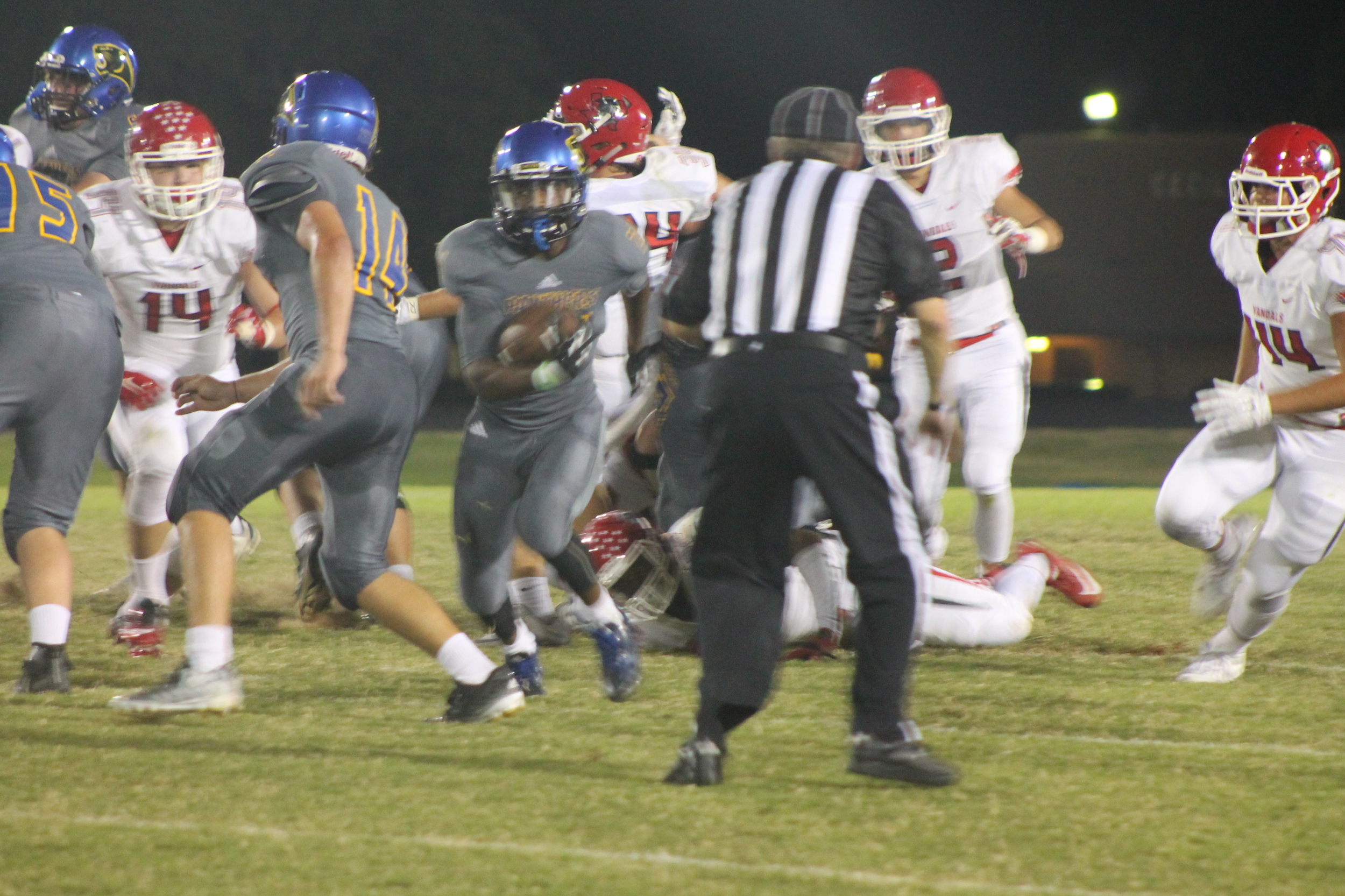 (Photo by Maddy Routon) Javon Franklin cutting through the line against Van.