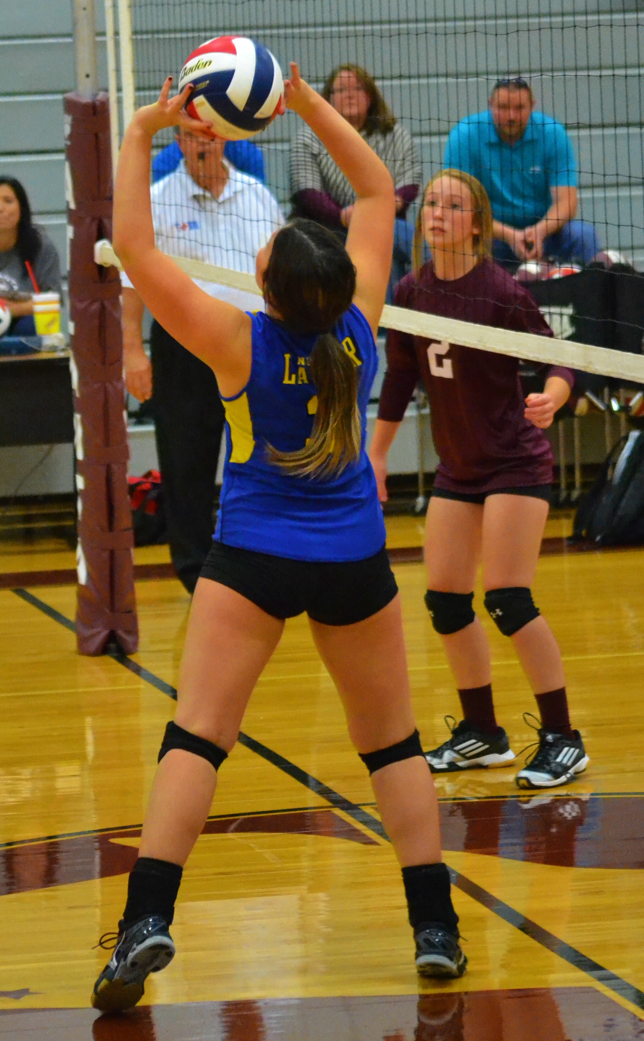 (Photo by Beverly White) Freshman Kimber Scott setting the ball against Atlanta