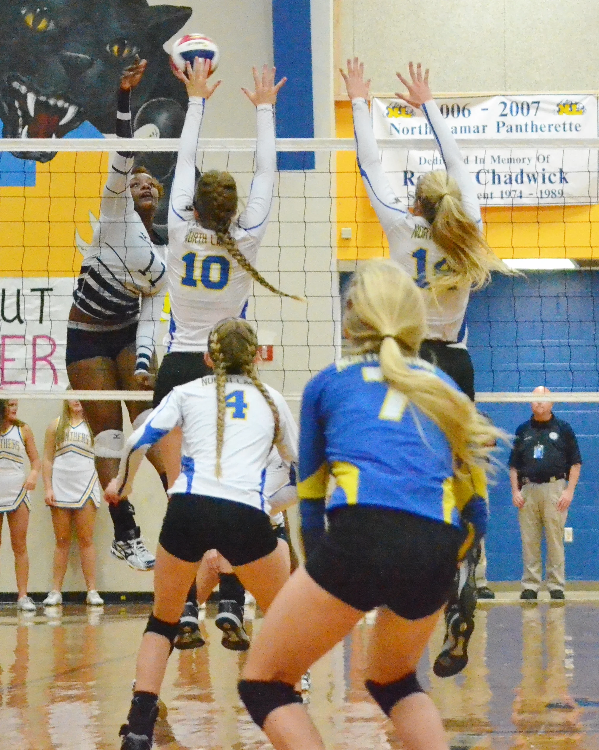 (Photo by Beverly White) Bailee Nickerson (10) and Bailey Foy (14) going for up a block for the Pantherettes against Paris High. 