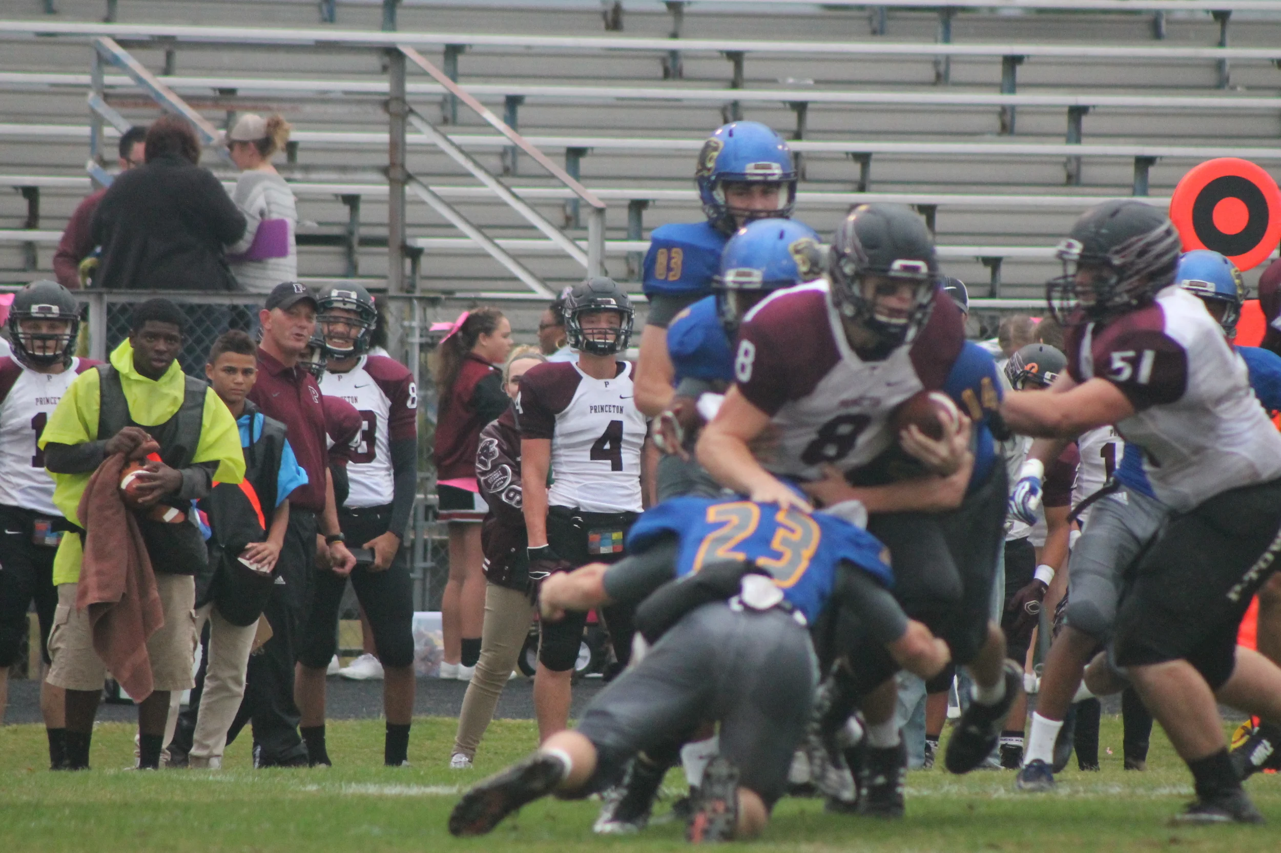 (Photo by Maddy Routon) Austin Exum (23) making a tackle on Princeton's quarterback.