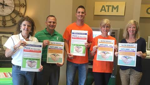 Guaranty Bank & Trust joins as a collection site for the Paris- North Lamar Crosstown Showdown Food Drive. From left are Jeanne Kraft of PISD, Guaranty representatives Jerimy Bell, Kenny Dority, and Tina Skidmore, and Carla Coleman of NLISD.