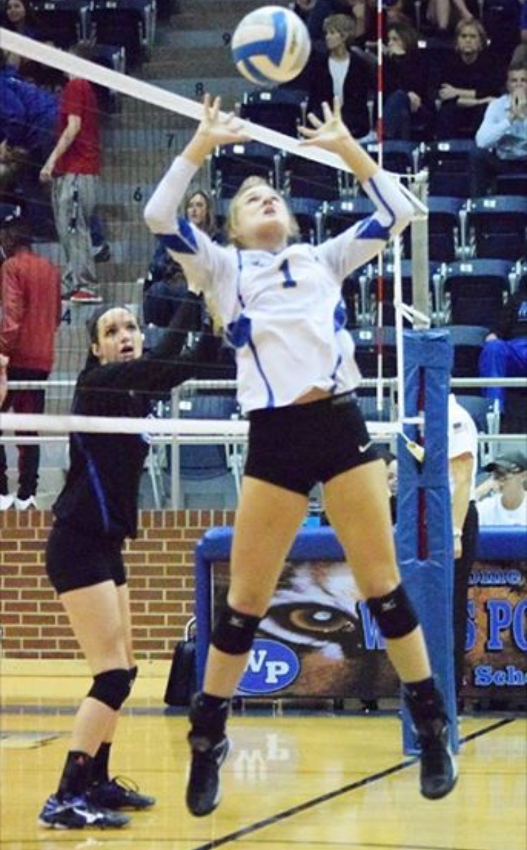 (Photo by Beverly White) Kayla Igleheart setting the ball against Spring Hill.