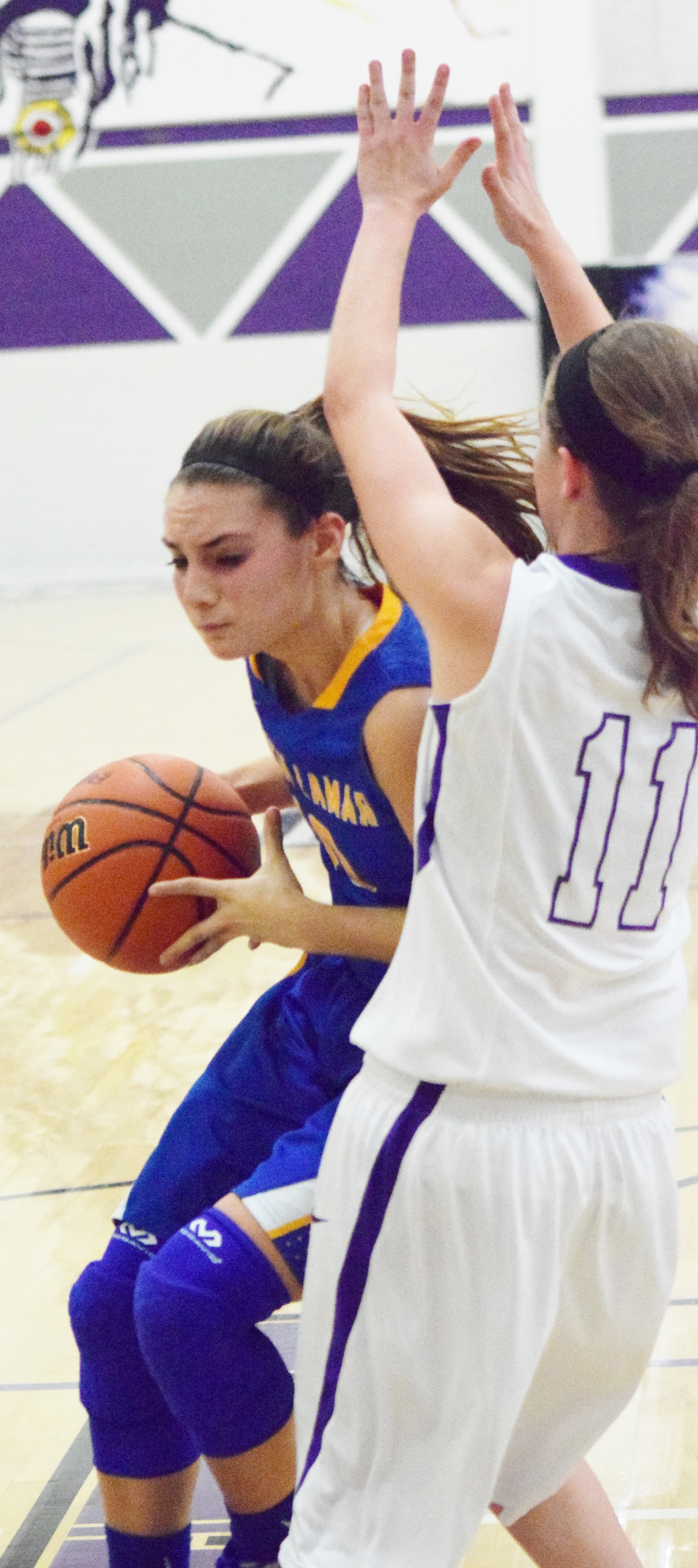 (Photo by Beverly White) Madison Morrison driving against a Bonham defender in the season opener for North Lamar.