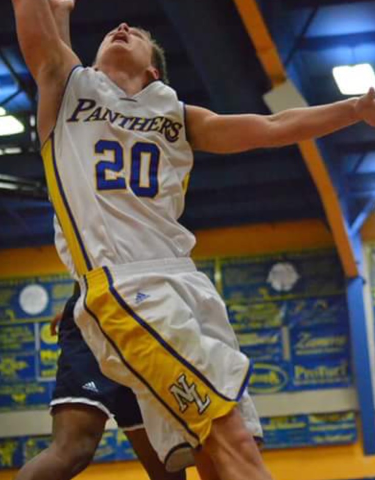 (Photo by Beverly White) Levi Porter with a layup attempt against Paris