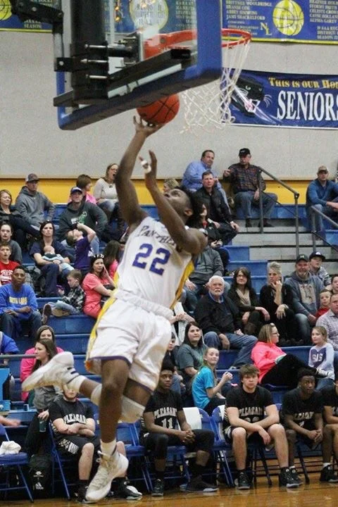 (Photo by Amber Clark) Tyler Hill with a layup for North Lamar against PG