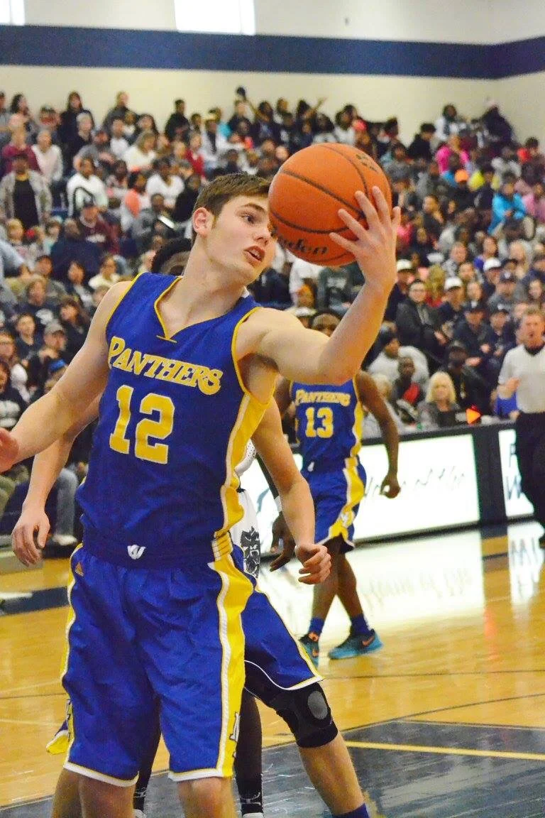 Photo by Beverly White: Jake Stewart grabbing a rebound earlier in the season against Paris High