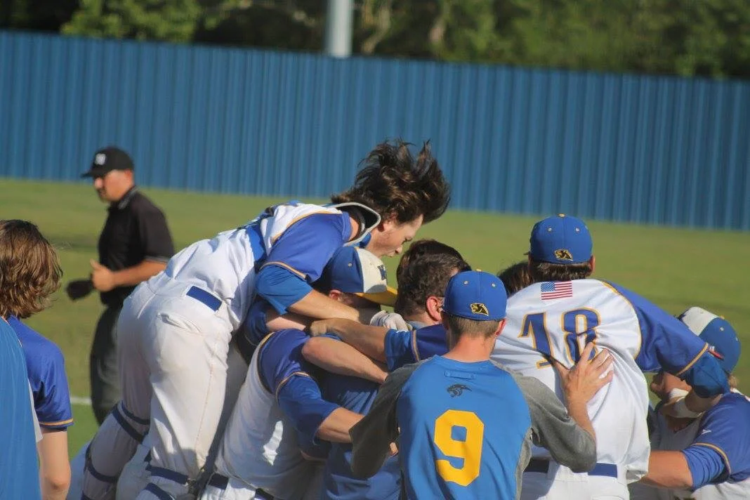 (Photo by Amanda Anderson) Panthers dog piling each other after their dramatic series win on Saturday.