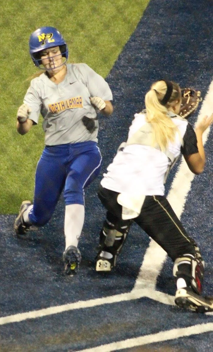(Photo by Amber Clark) Bailee Nickerson getting around the catcher to score for North Lamar.