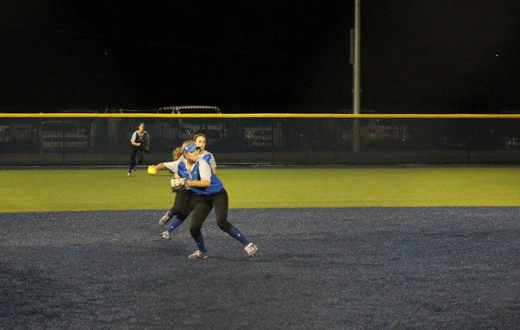 (Photo by Amber Clark) Erin Scholl with a throw to first for the final out of the series.