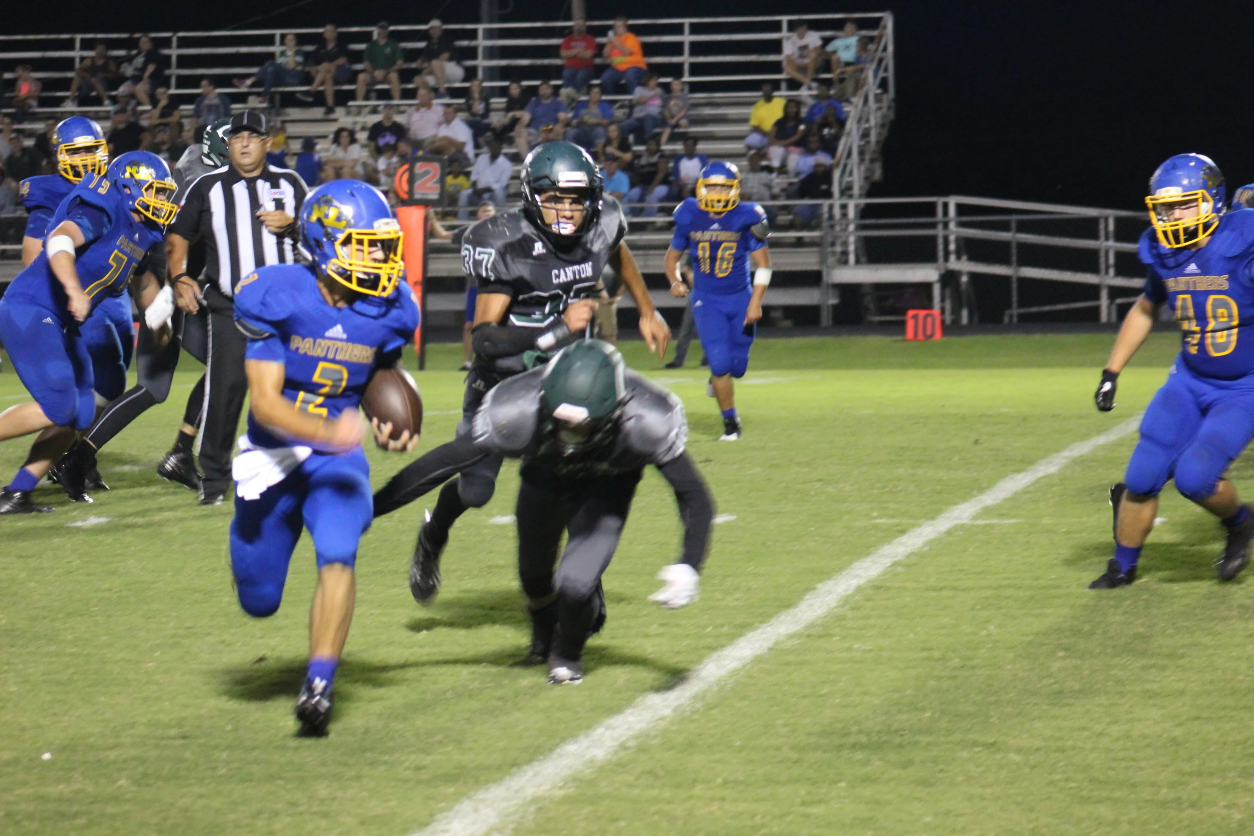(Photo by Aaron Routon) Sam Cowling running the ball for North Lamar against Canton