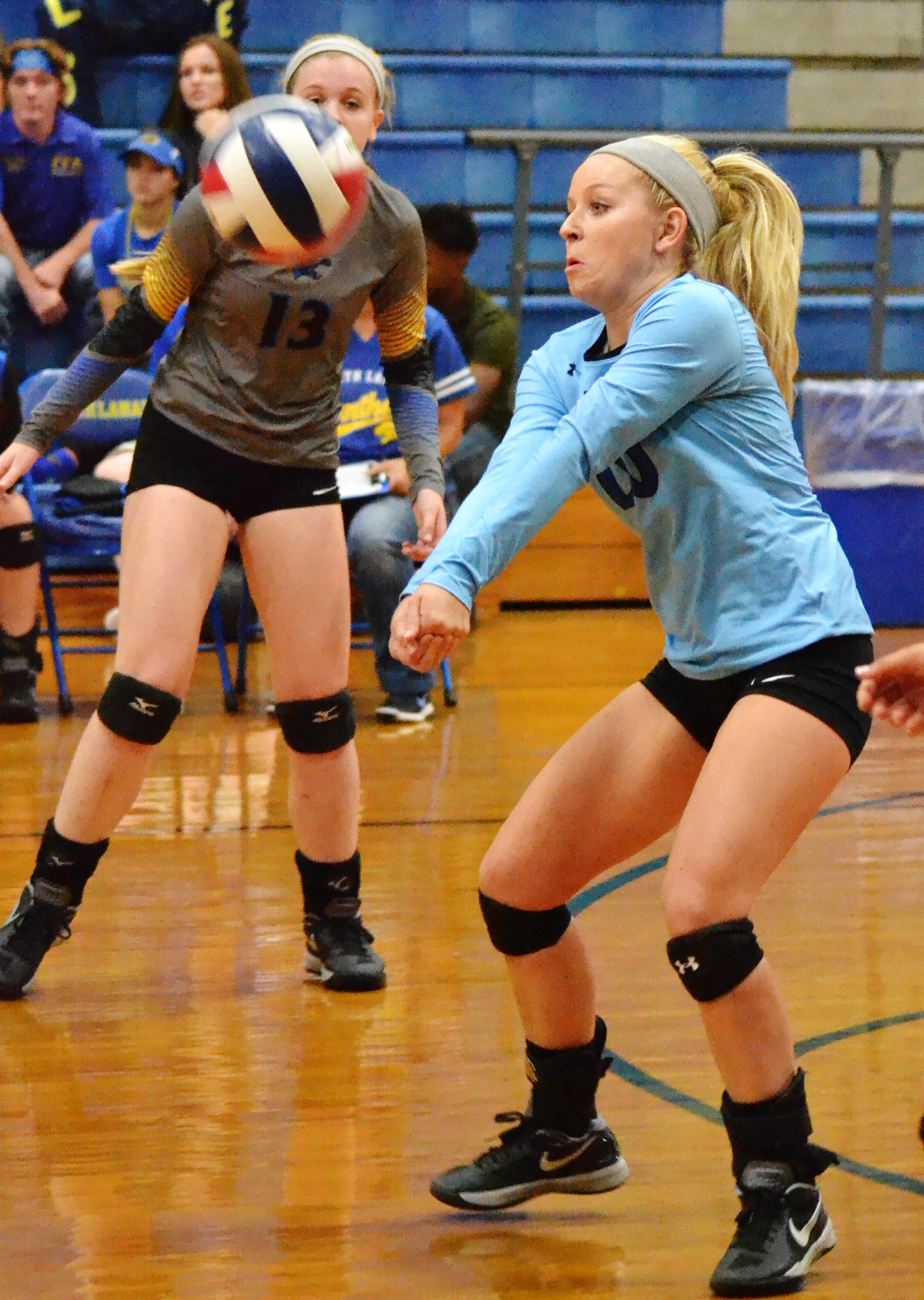 (Photo by Beverly White) Natalie Allen setting the ball for the Pantherettes against Pittsburg.