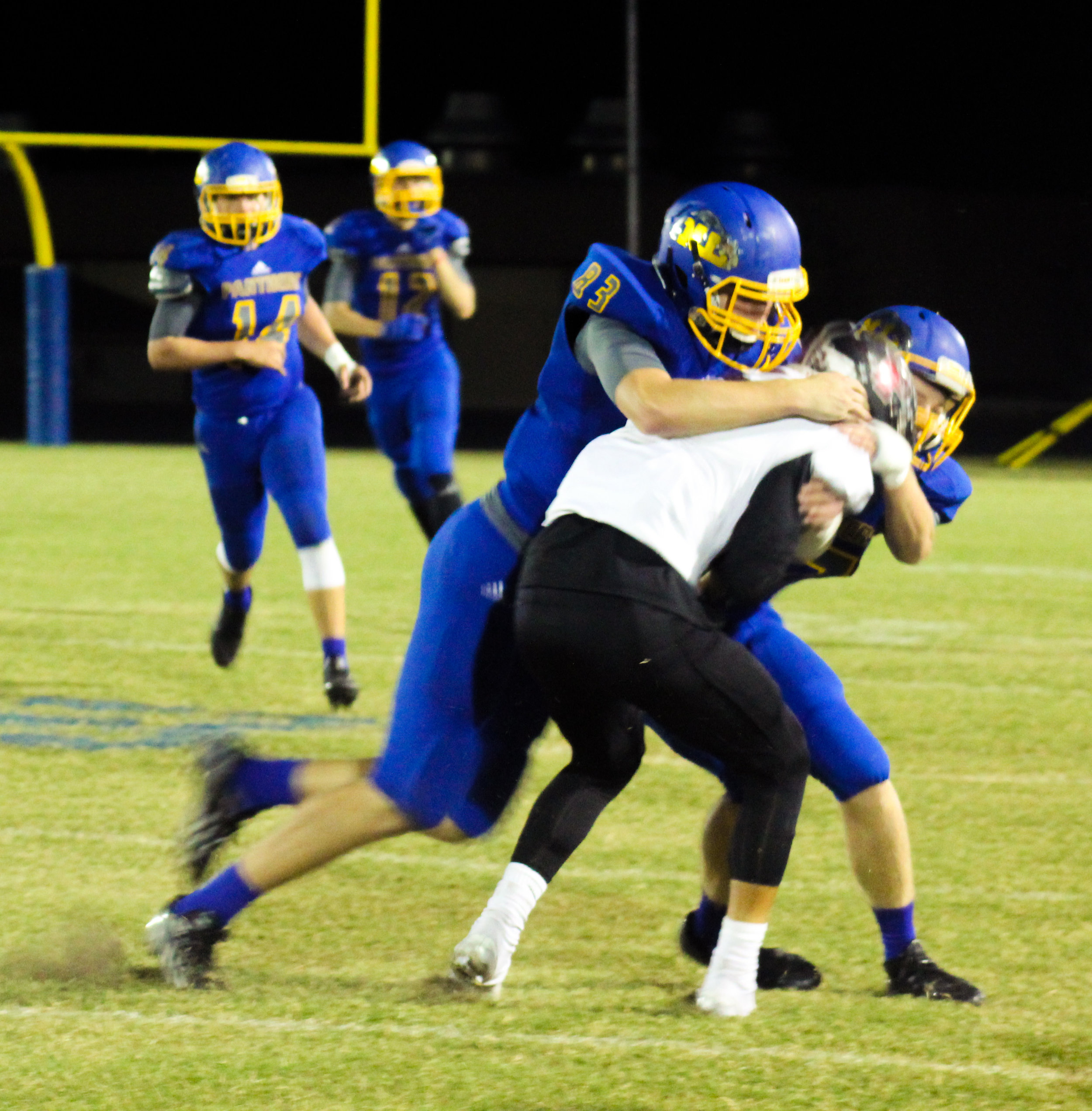 (Photo by Adam Routon) Jake Stewart (83) making a tackle for North Lamar.