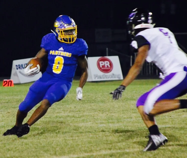 (Photo by Lynn English) Tyler Hill makes a move on an Anna defender