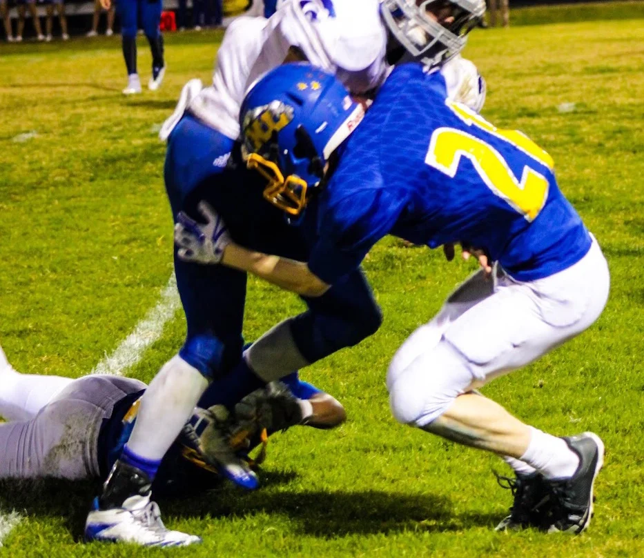 (photo by Lynn English) Grant Sulsar with a tackle