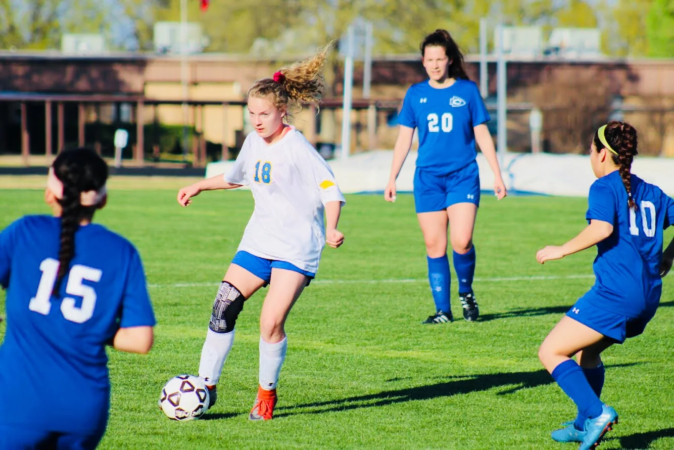 Jerika Johnson moves the ball through Community defenders