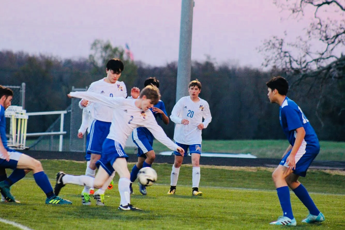 Grant Sulsar fights to take a shot on goal