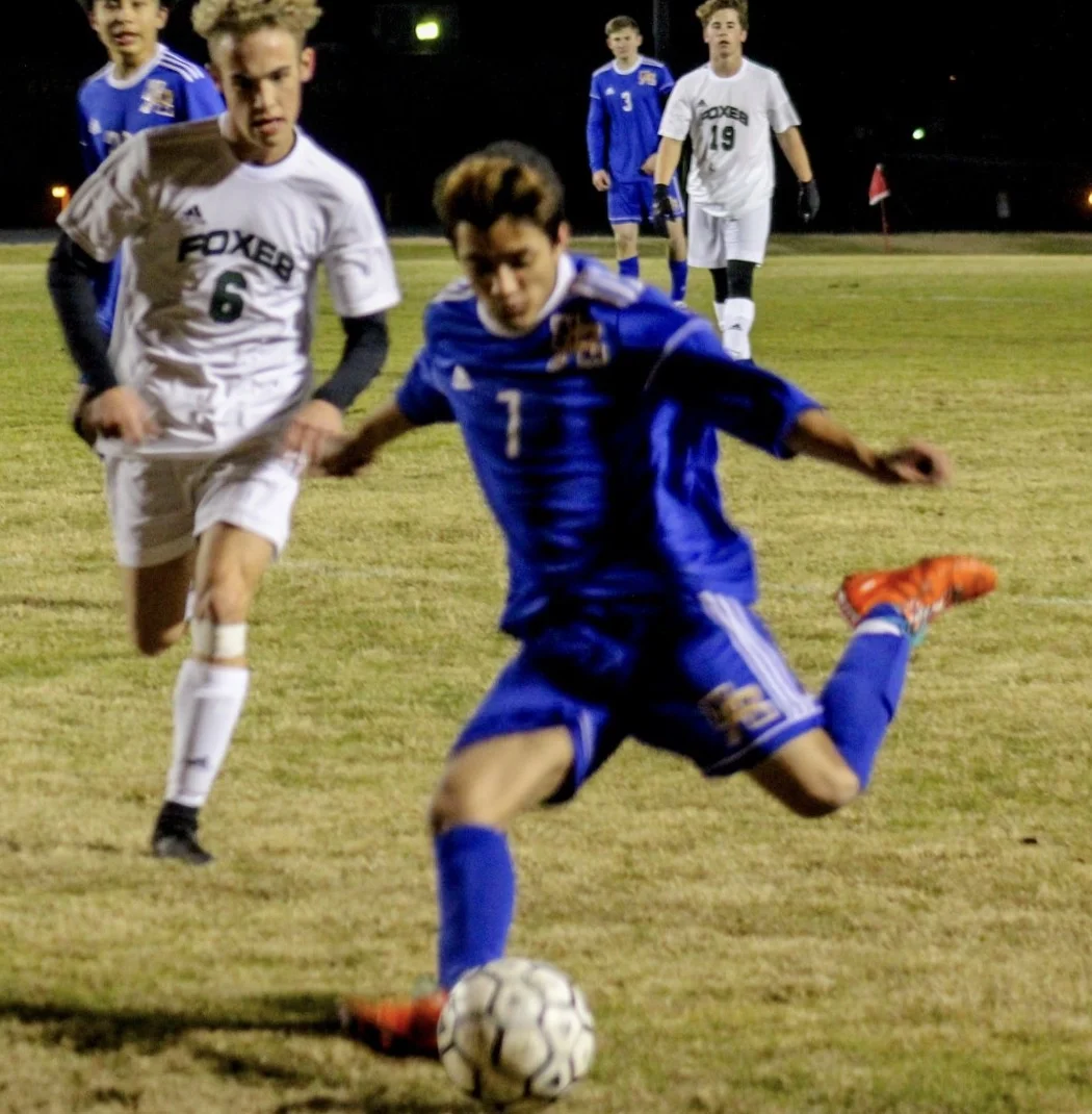 Kshitiz Basnet takes a shot (photo by Adam Routon)