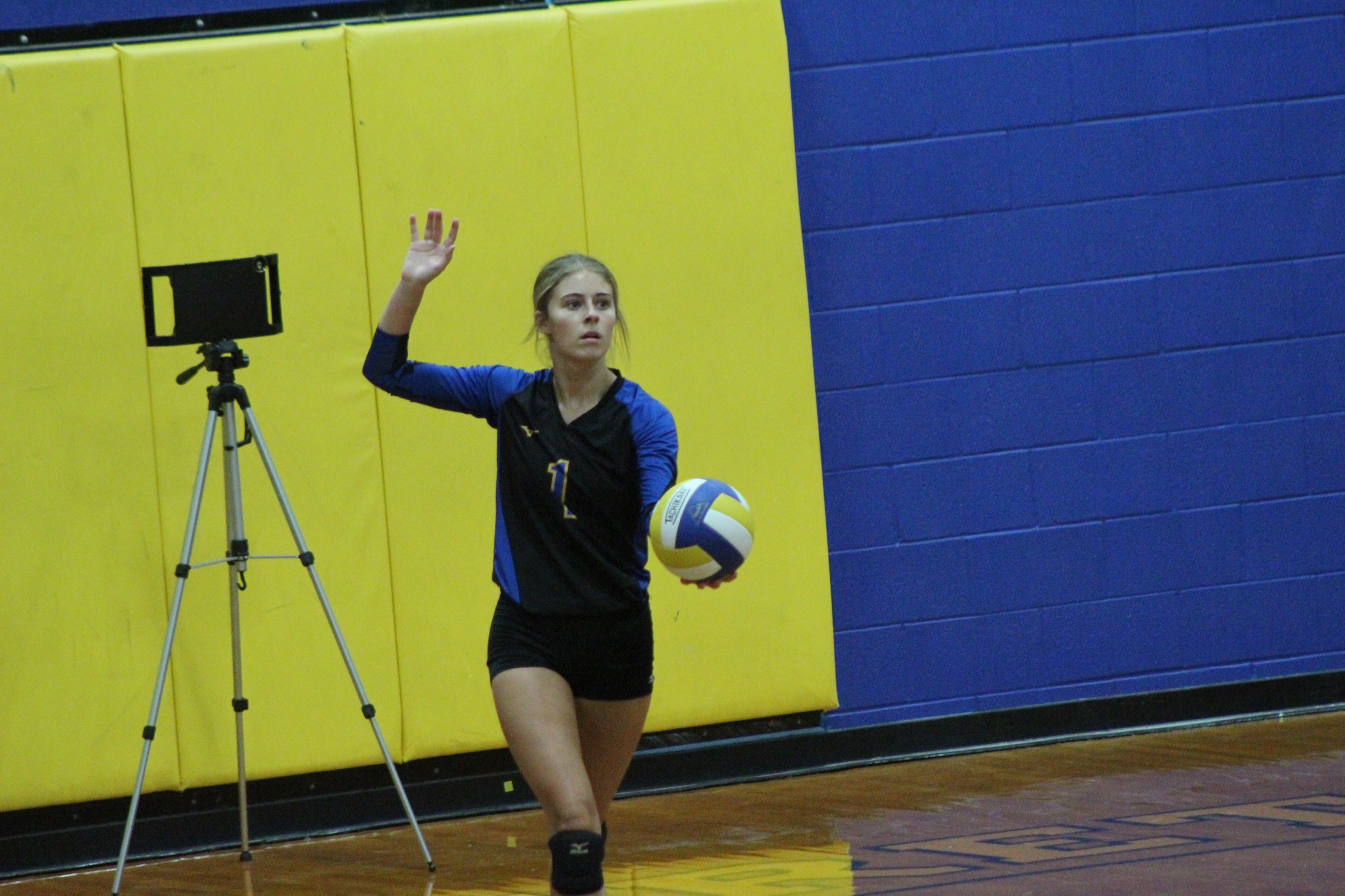 Kenley Coston getting ready to serve for the Pantherettes against Denison.