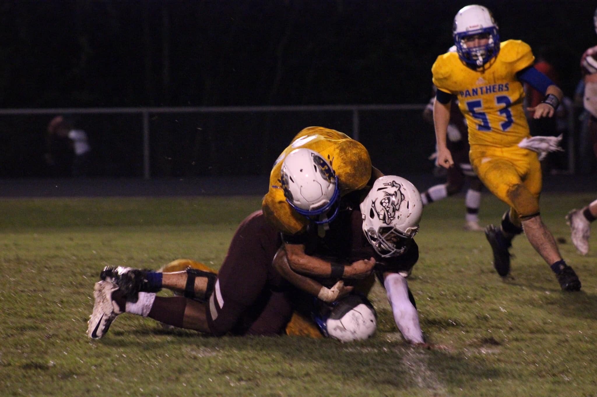 Photo by Lynn English: Mason Stephens with a tackle with Sam Creamer running to help.