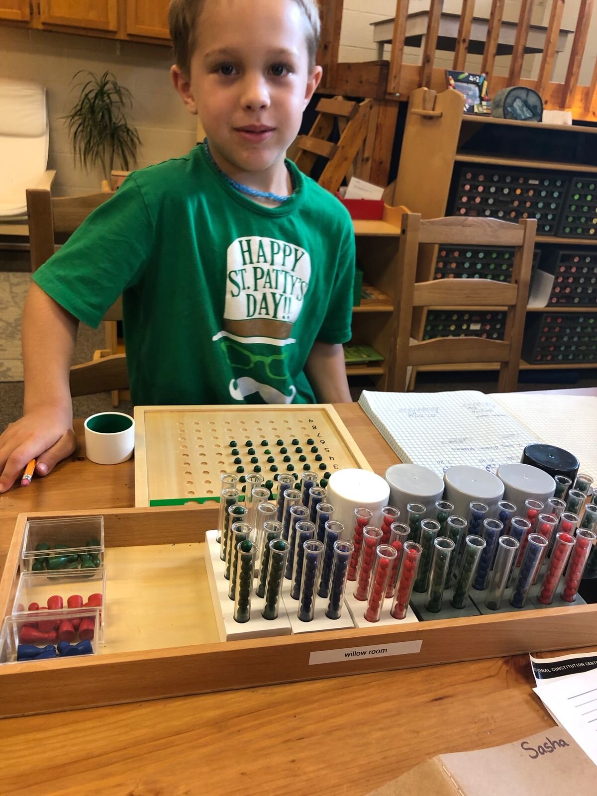 A second-grade student works on a division problem into the millions with the help of the Racks and Tubes. That’s a lot of beads to keep track of!