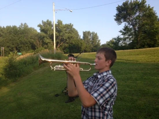  Playing Taps at the end of the ceremony. 