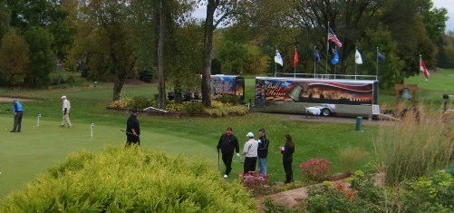  Golfers on the putting green before the tournament. 