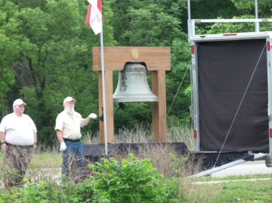  Bell of Honor Member, Dick Denny tolls the Bell of Honor at the Zumbrota Field of Honor Ceremony 
