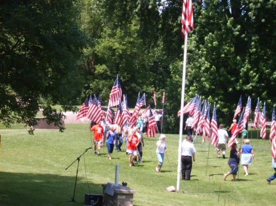  Bell of Honor Committee members assited the Wanamingo Color Guard in the placement of the flag 