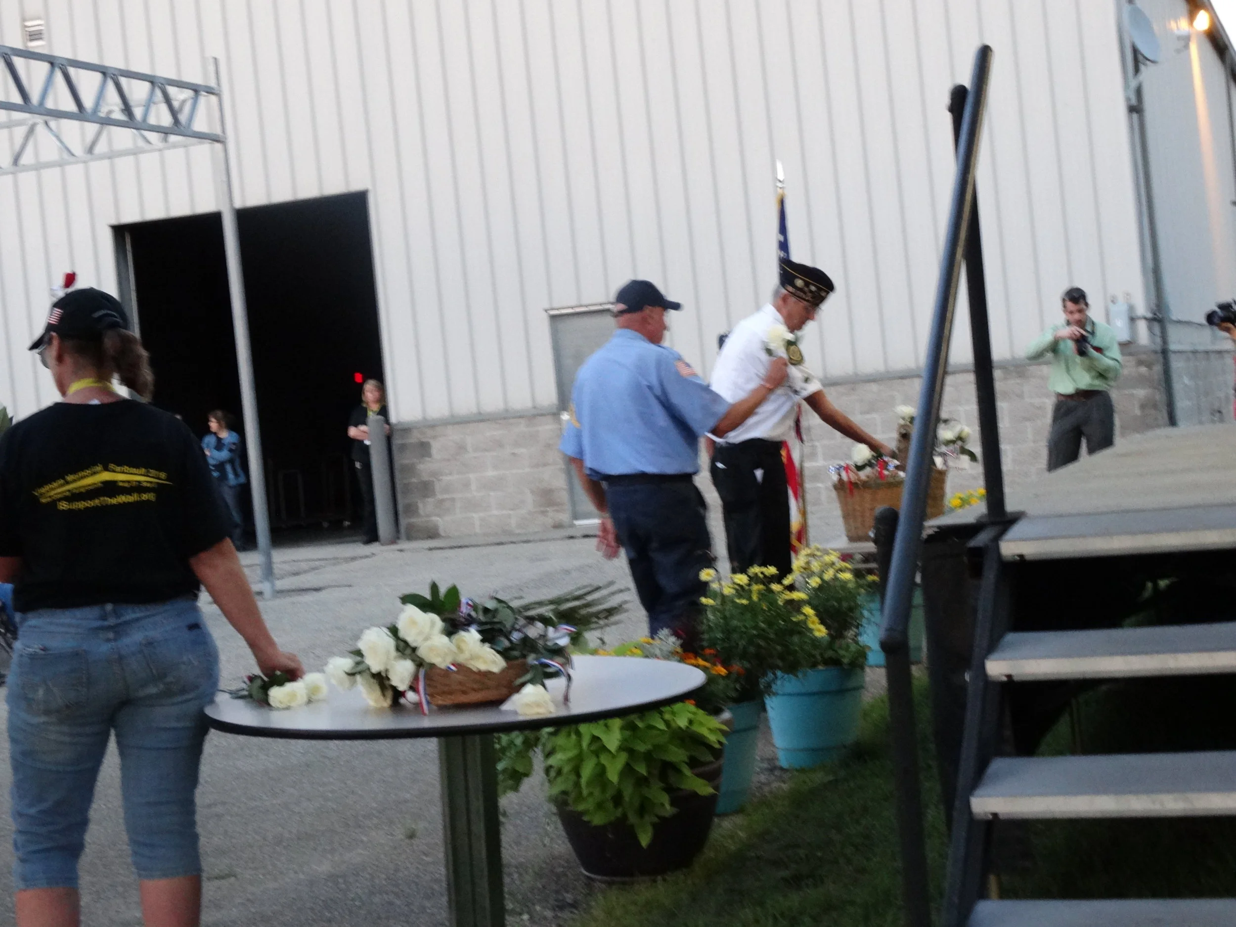 Honor Guard placing white roses 