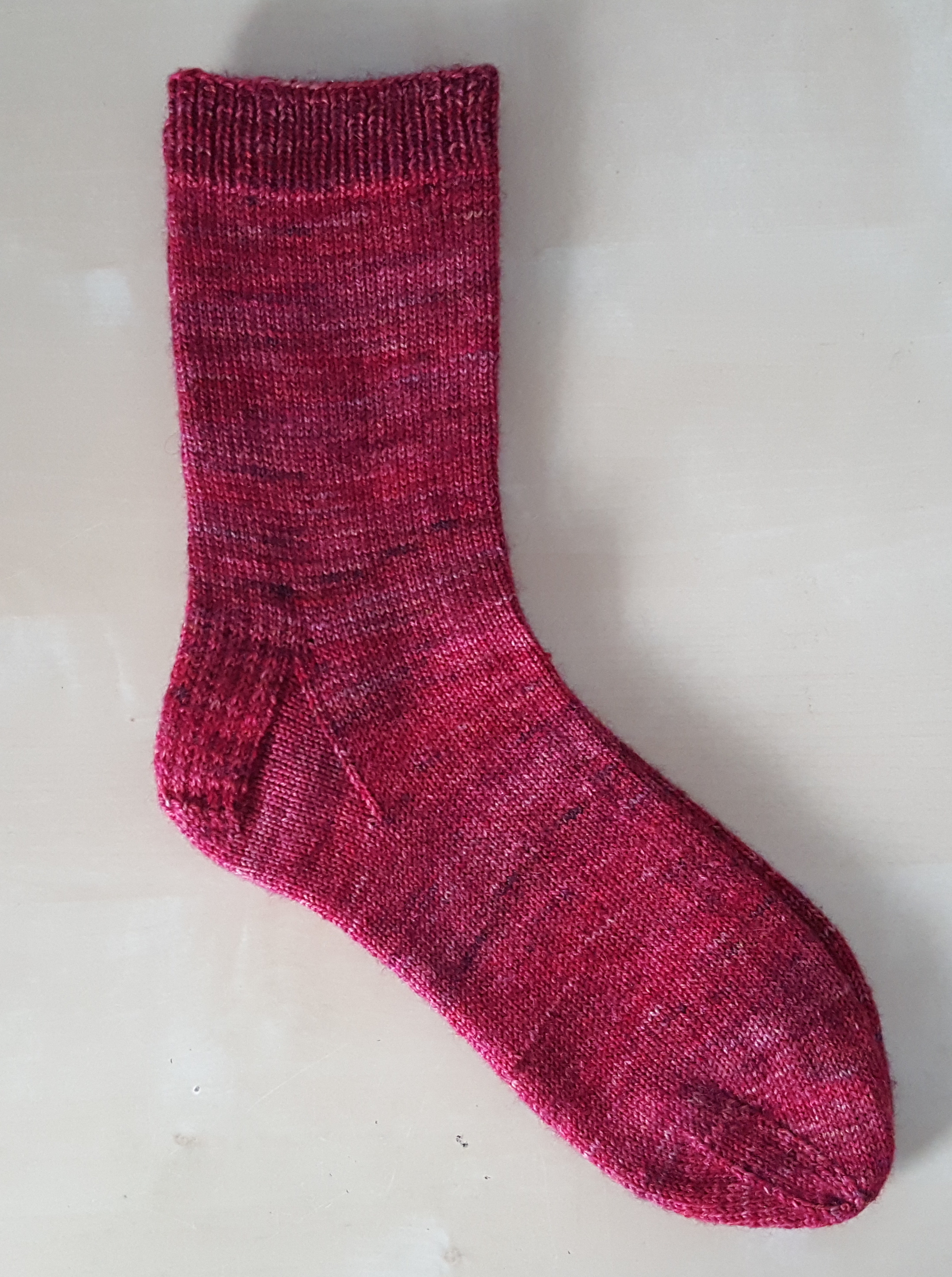 Yarn: Palindrome Knits - Three Sisters Sock Colourway: Bleeding Heart Needles: 2.25mm Details: 68sts, Top-Down with Heel Flap