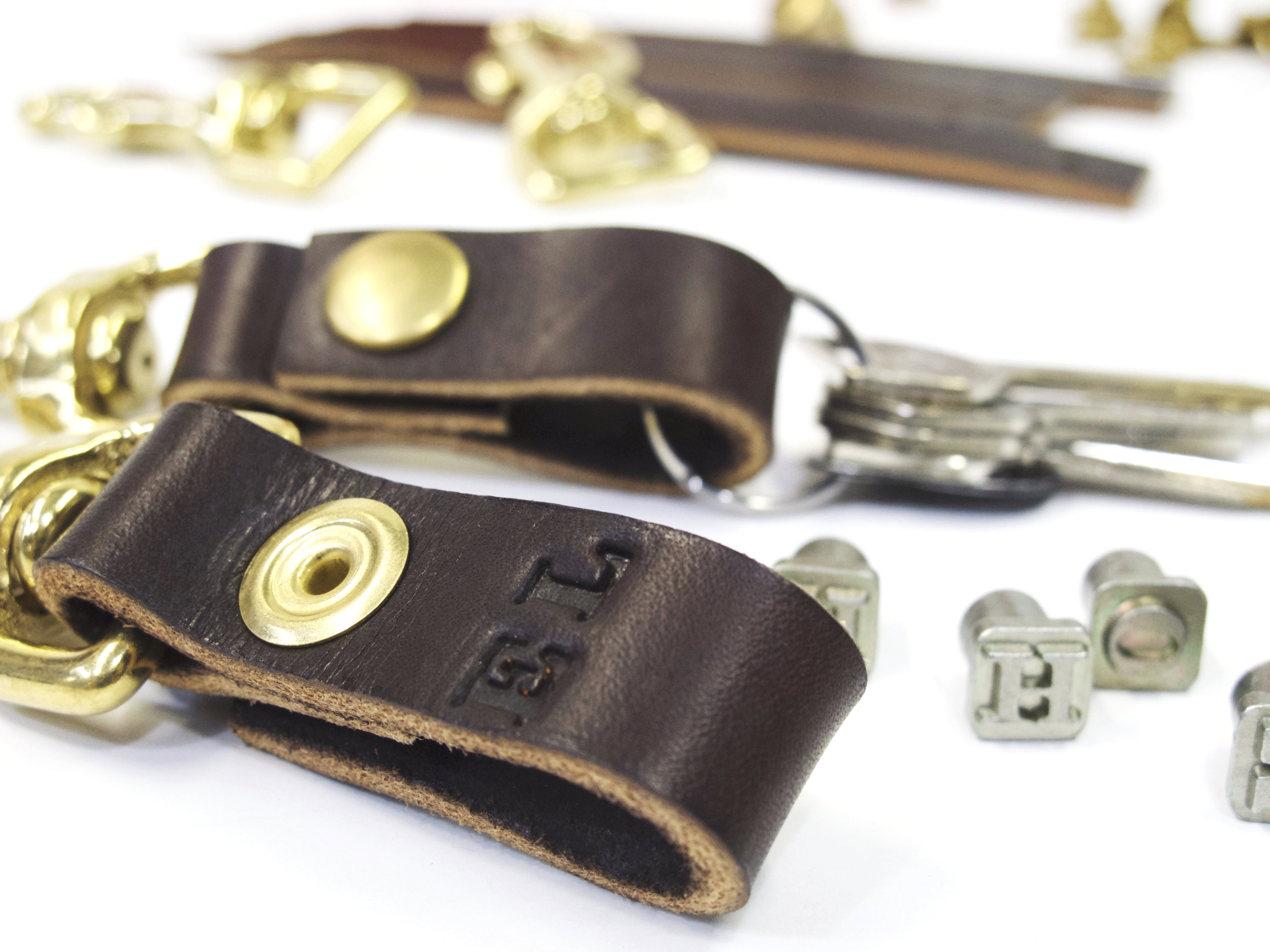 brown leather key holder with stamps 2.jpeg