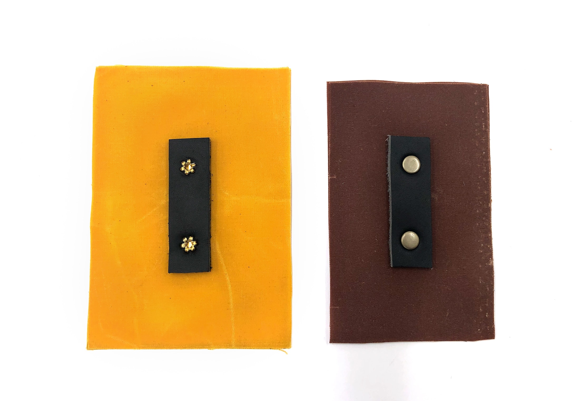 Back side of a set tubular rivet on the left, set double-cap river on the right
