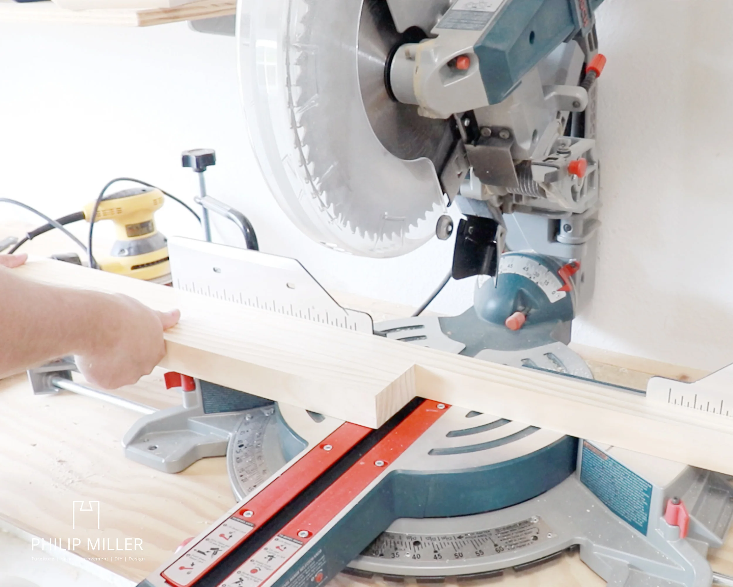 cutting the rails for the ring toss game using my Bosch Miter saw