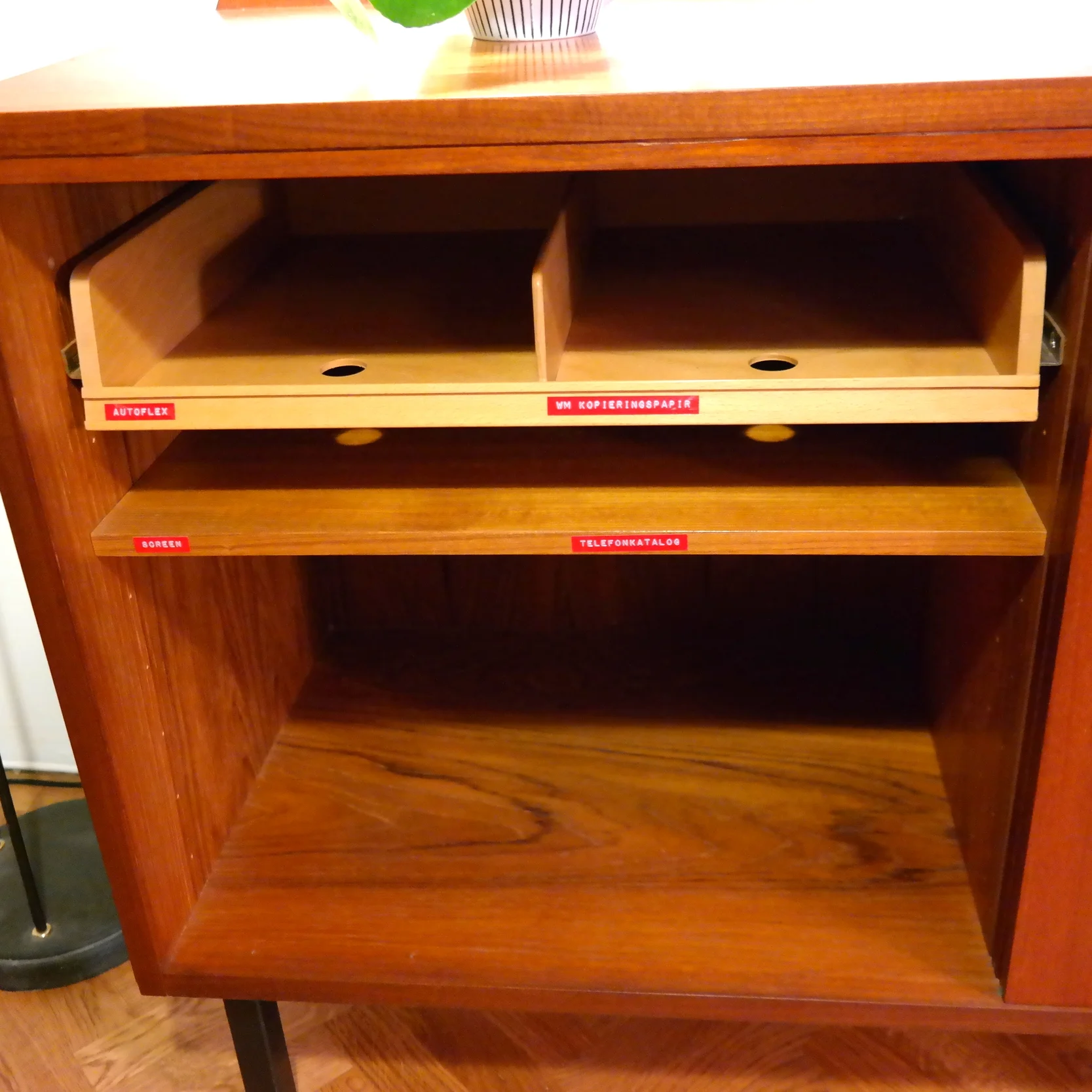 A place for the phonebook and copy paper