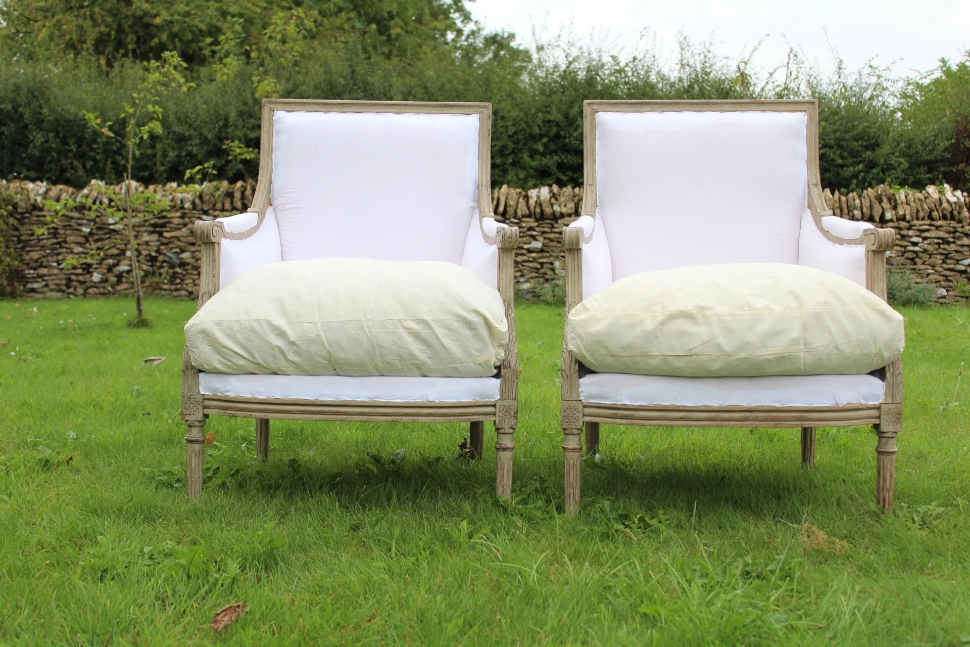 A pair of Swedish vintage armchairs , in calico
