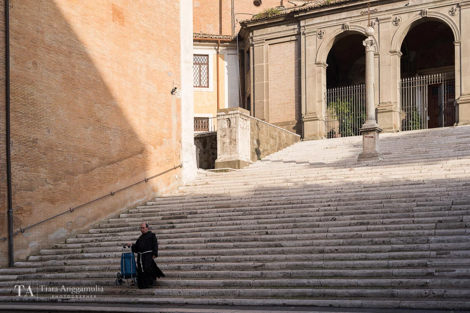Monk coming down the steps at Capitoline Hill.