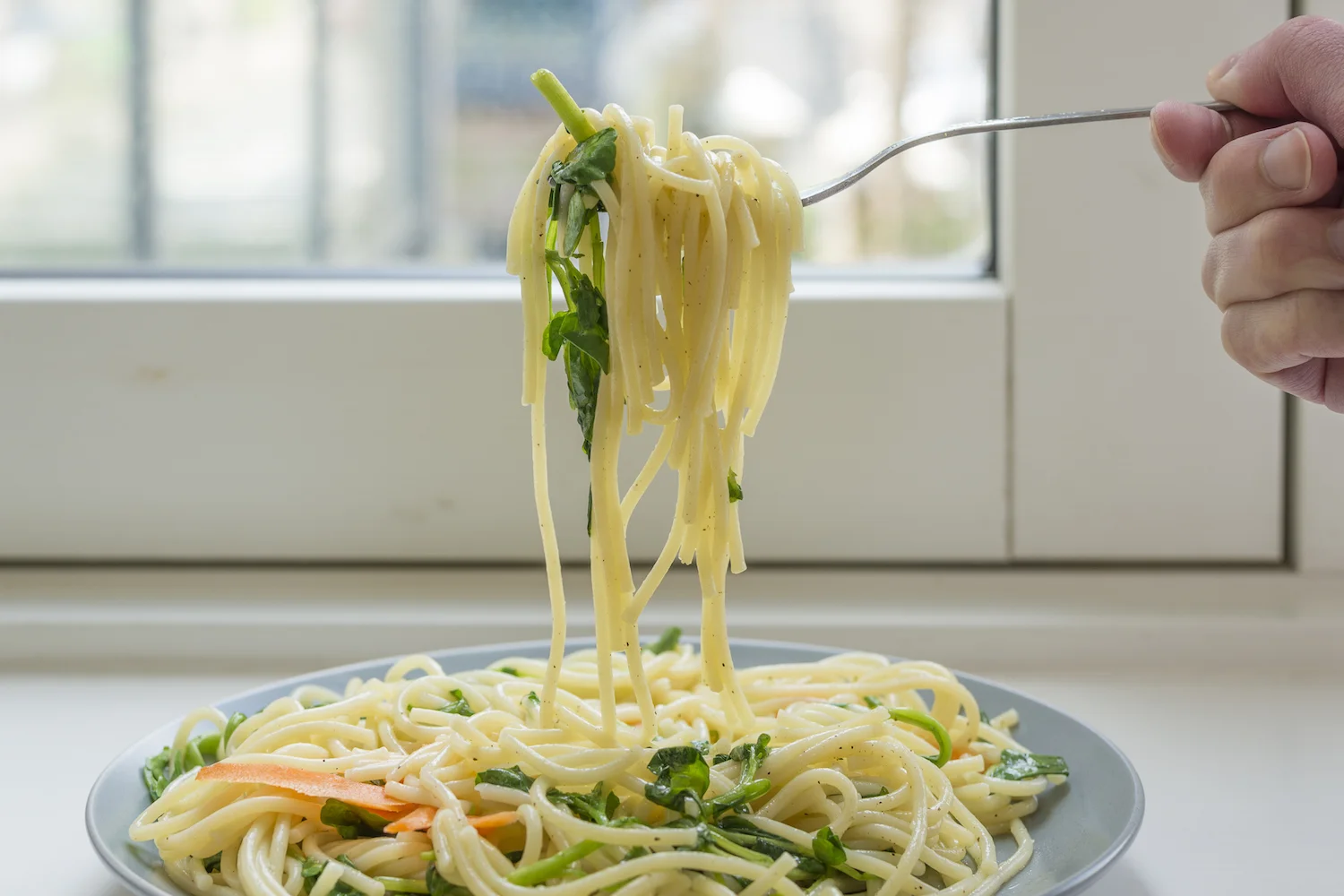 Eating pasta with baby leaf watercress and carrots.jpg
