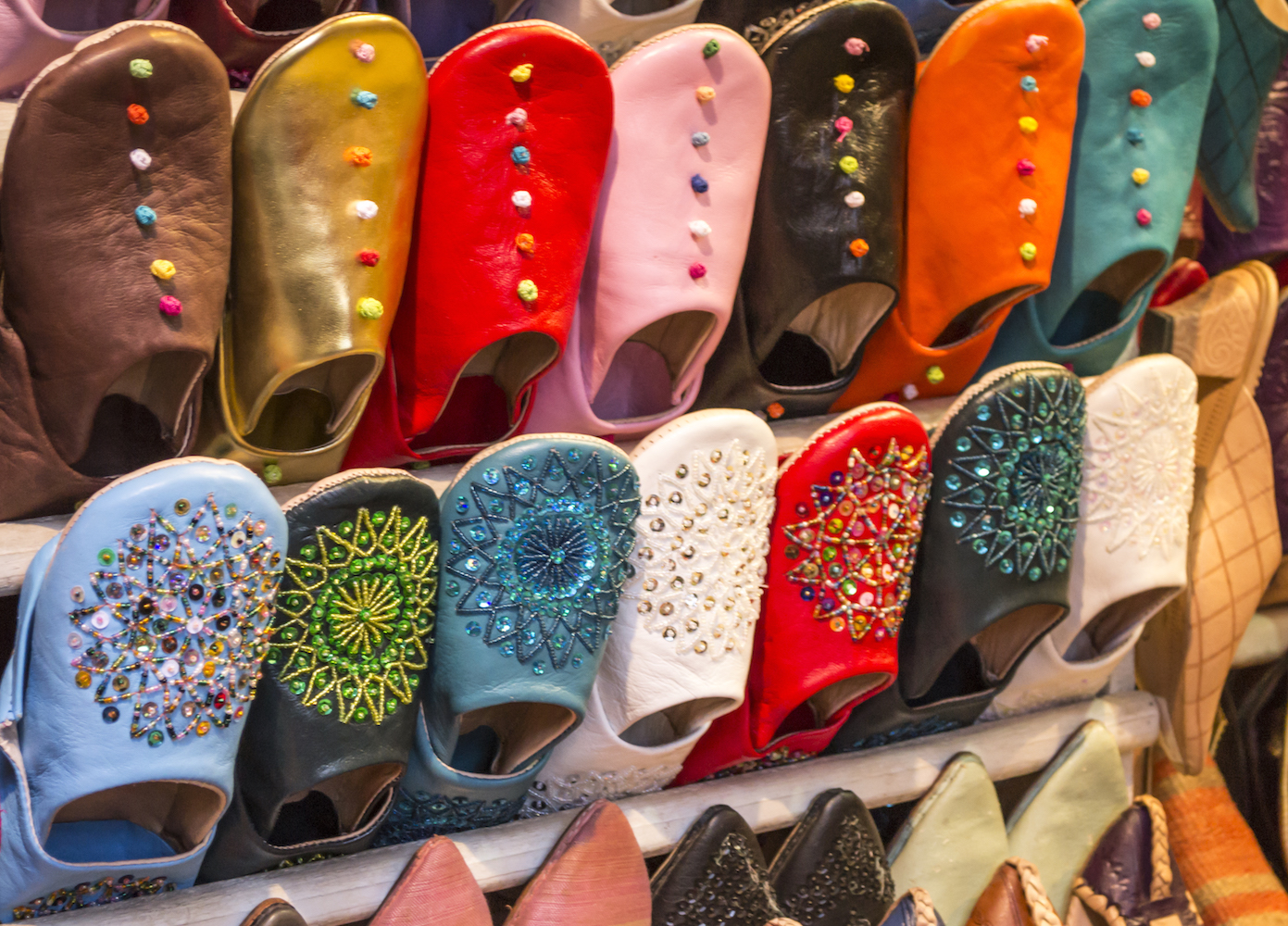 Colourful slippers on display in a Marrakech market stall.jpg