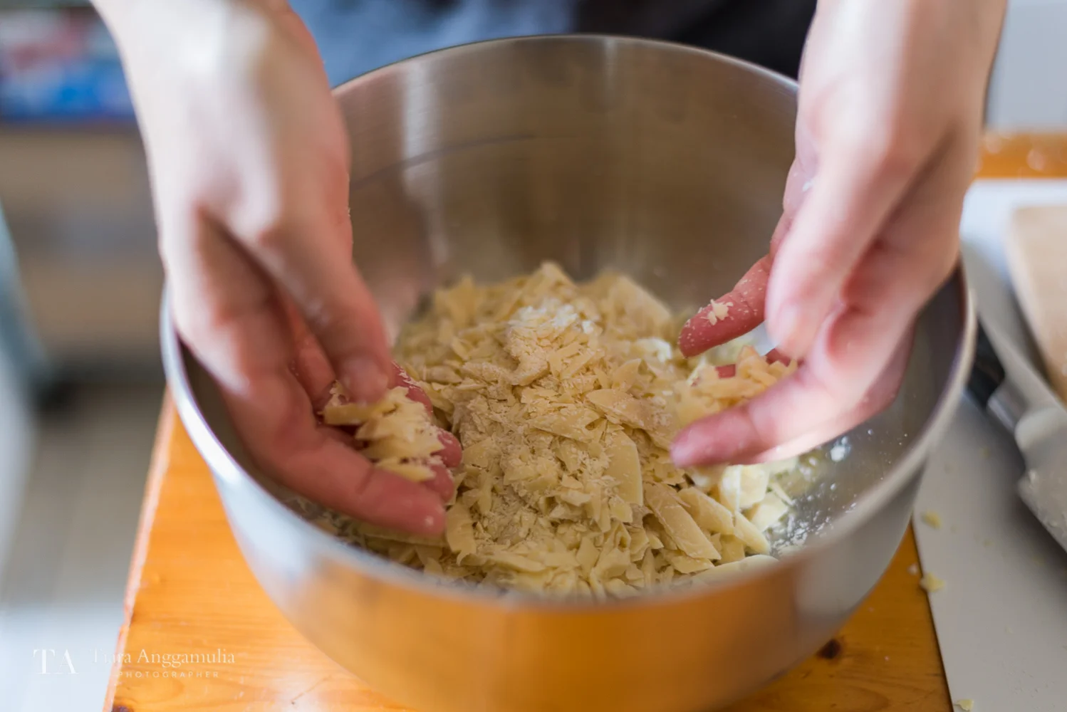 A bowl of shaved raw cacao butter.