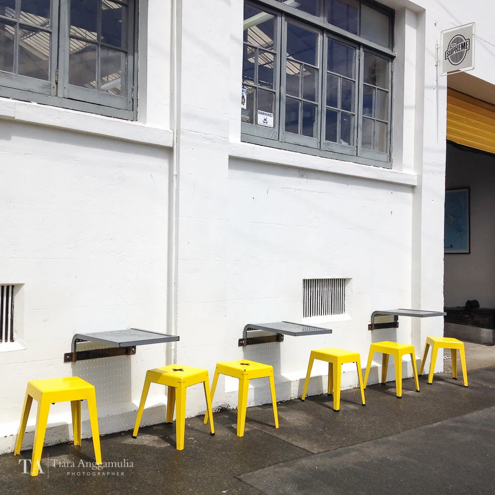 Yellow chairs outside the Good One coffee shop.
