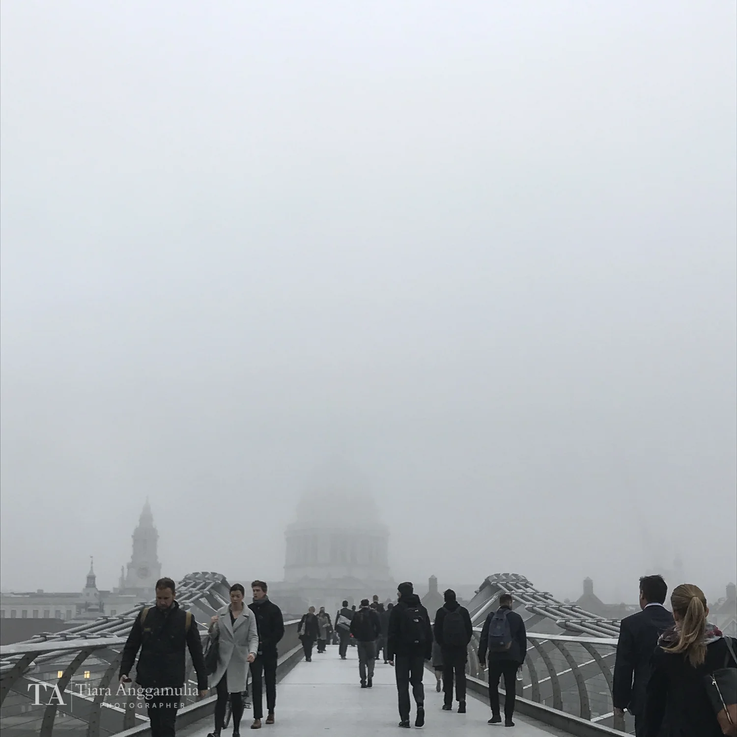 Morning commuters on Millennium Bridge.